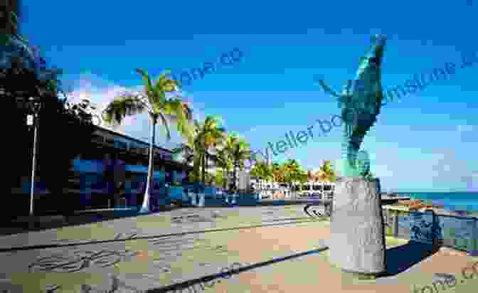 A Captivating Image Of The Malecón In Puerto Vallarta, Showcasing The Beautiful Oceanfront Promenade Lined With Palm Trees And Charming Buildings. Economic Life Of Mexican Beach Vendors: Acapulco Puerto Vallarta And Cabo San Lucas