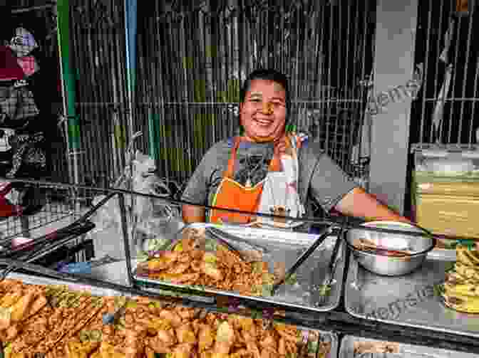 A Street Vendor In Bangkok Preparing A Dish, Surrounded By Fresh Ingredients. Street Food Asia: Saigon Bangkok Kuala Lumpur Jakarta
